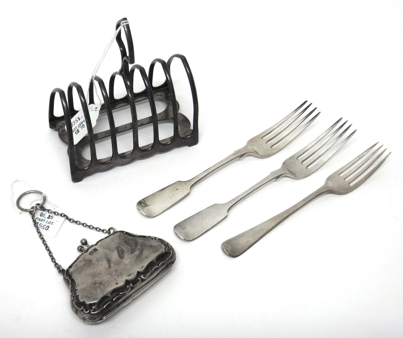 Appraisal: Silver comprising a Victorian seven bar toastrack of arched form