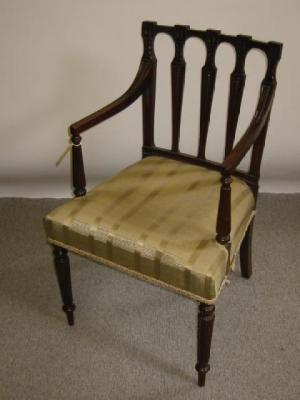 Appraisal: AN EDWARDIAN MAHOGANY ELBOW CHAIR of Georgian design the three