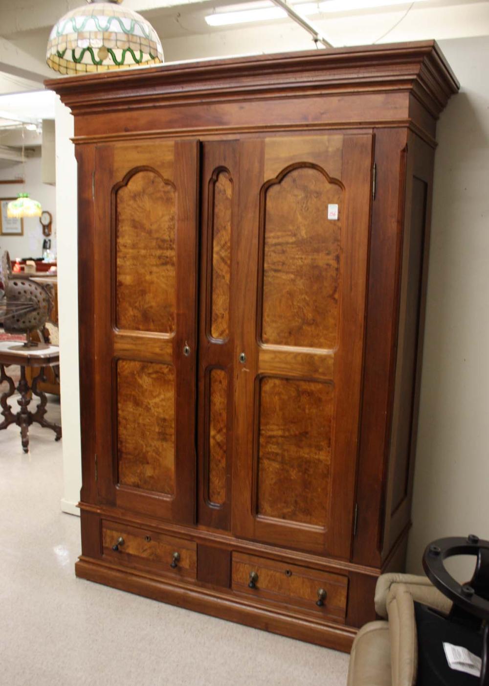 Appraisal: AMERICAN VICTORIAN WALNUT WARDROBE American late th century having twin