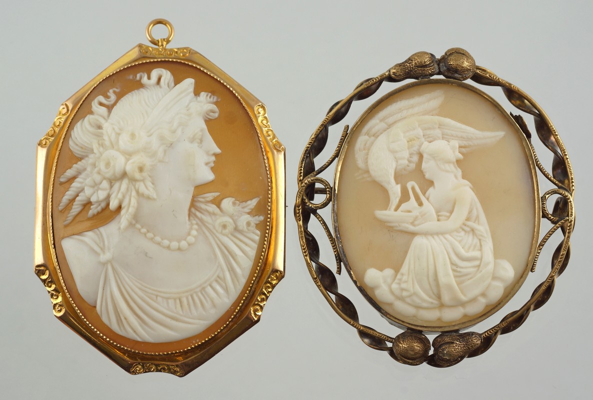 Appraisal: Unmarked YG oval carved shell cameo pins woman with flowers