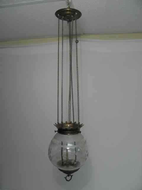 Appraisal: Victorian engraved glass and brass hanging lamp Globe is engraved