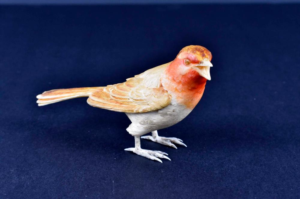 Appraisal: CHINESE POLYCHROME CARVED BIRDCirca Unsigned With a red breast and