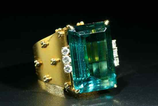 Appraisal: K YELLOW GOLD DIAMOND AND TOURMALINE RING Emerald-cut teal color