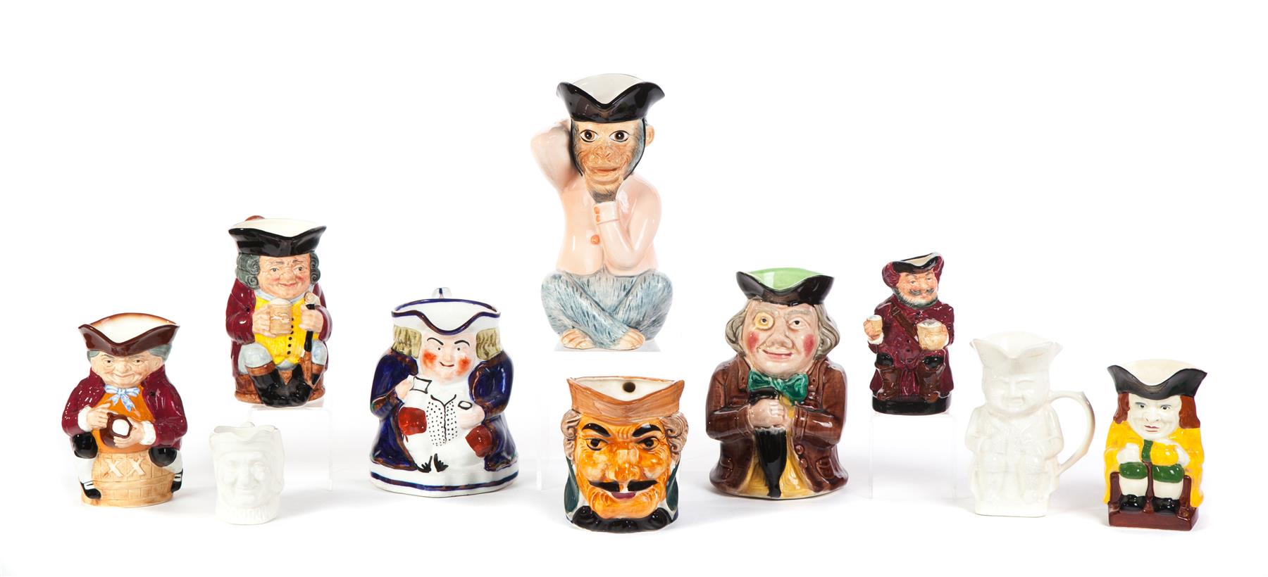 Appraisal: TEN CHARACTER PITCHERS INCLUDING ROYAL DOULTON England th century Includes