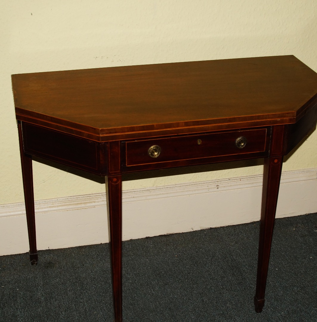 Appraisal: A thC mahogany tea table the canted rectangular top with