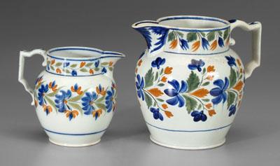 Appraisal: Two pearlware pitchers similar designs with multi-colored flowers and leaves