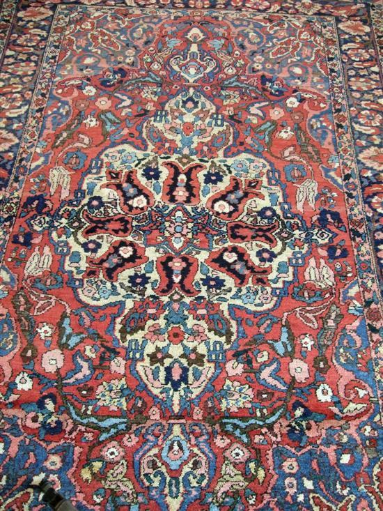 Appraisal: Red ground Persian rug with multiple borders the centre with