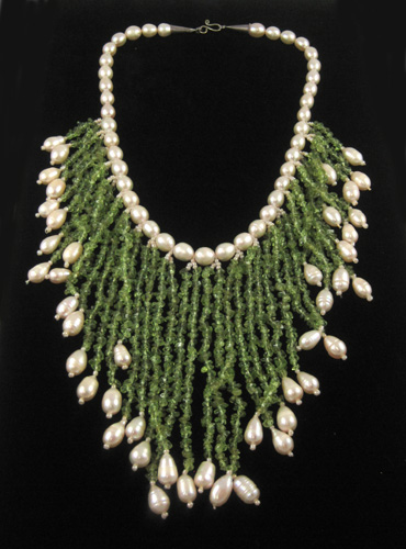 Appraisal: BAROQUE PEARL NECKLACE WITH PERIDOT beaded and graduated fringe collar