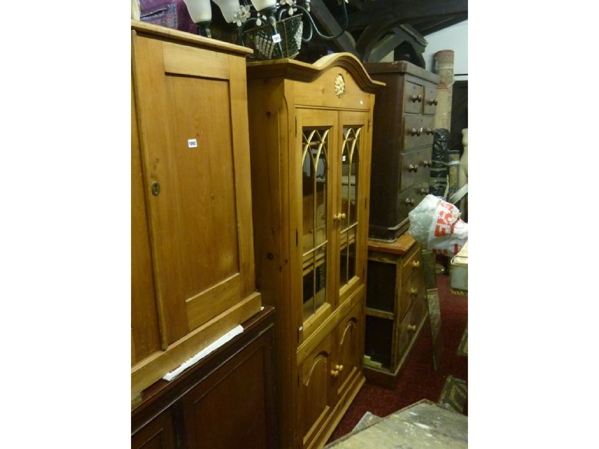 Appraisal: A pine freestanding side cupboard enclosed by a pair of