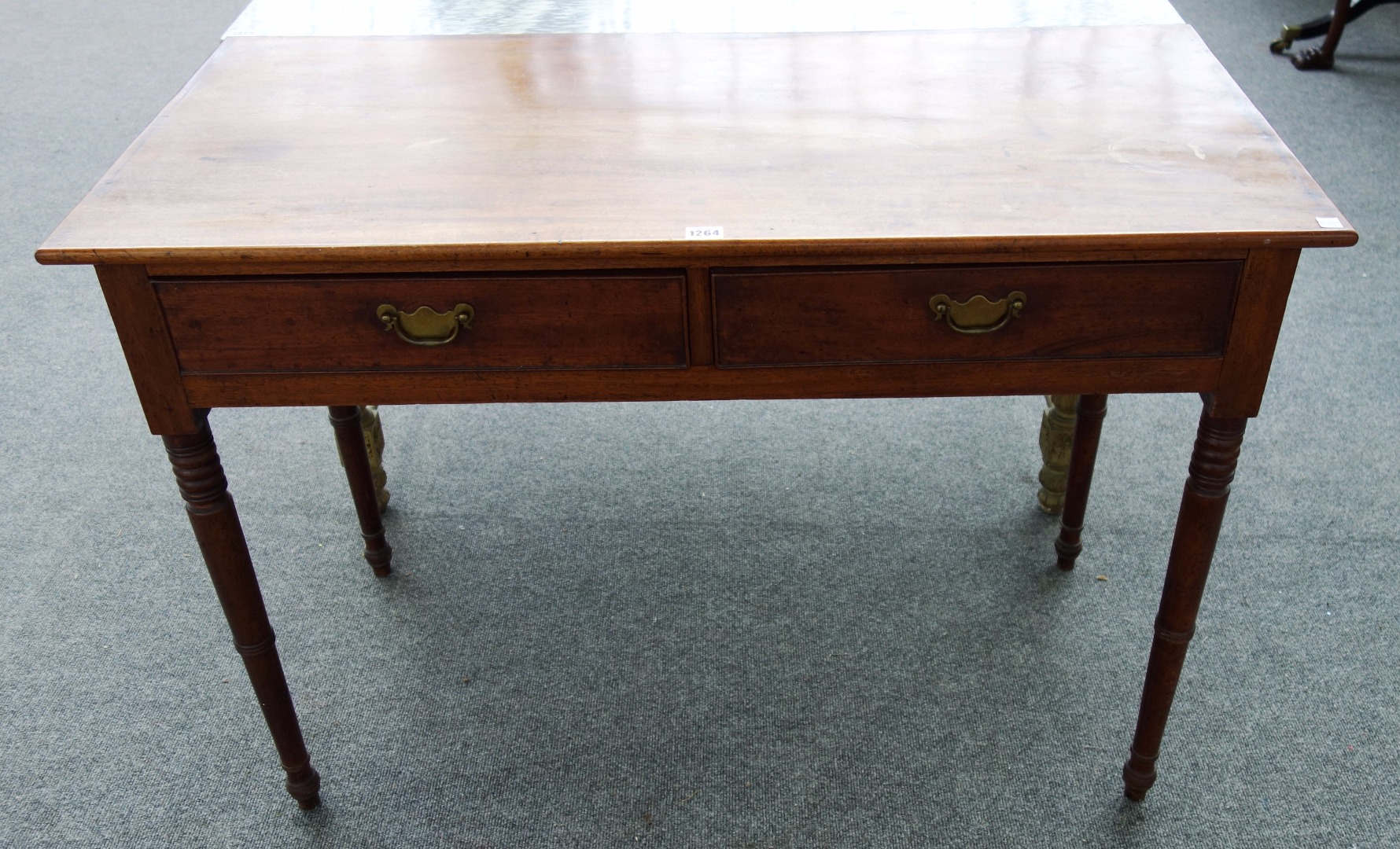 Appraisal: A th century mahogany two drawer writing table on turned