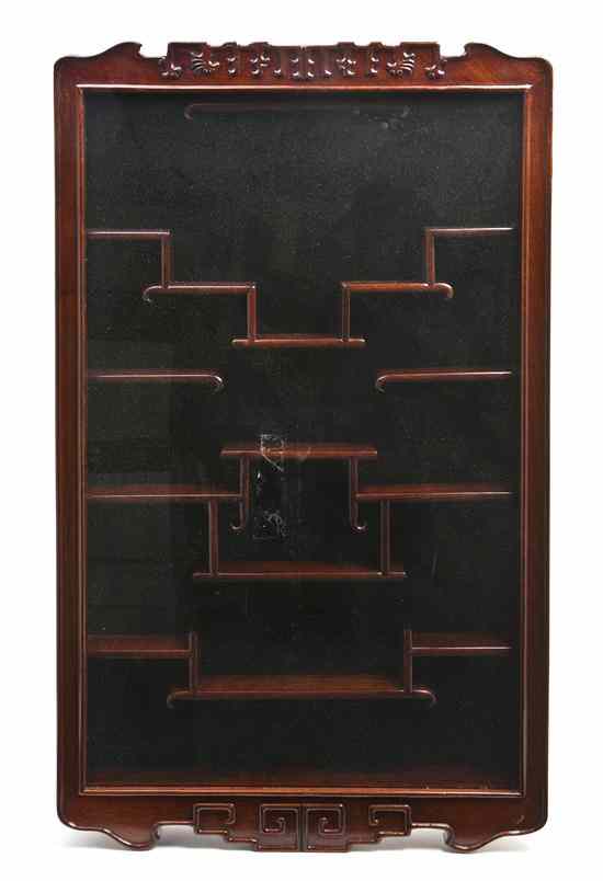 Appraisal: A Chinese Hardwood Hanging Vitrine Cabinet of rectangular form having