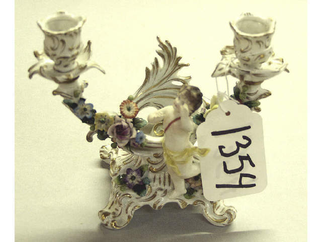 Appraisal: C late 's Sitzendorf double candlestick featuring a cherub and