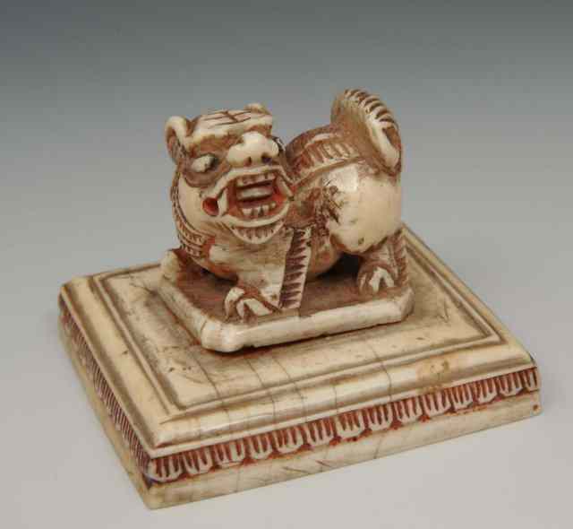 Appraisal: A CHINESE IVORY SQUARE SEAL with Dog of Fo finial