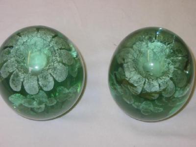 Appraisal: A PAIR OF VICTORIAN GREEN GLASS DUMPS with flower pot