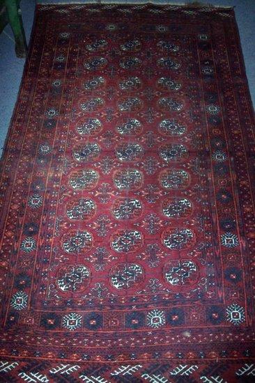 Appraisal: An Eastern rug with thirty elephant foot medallions on a