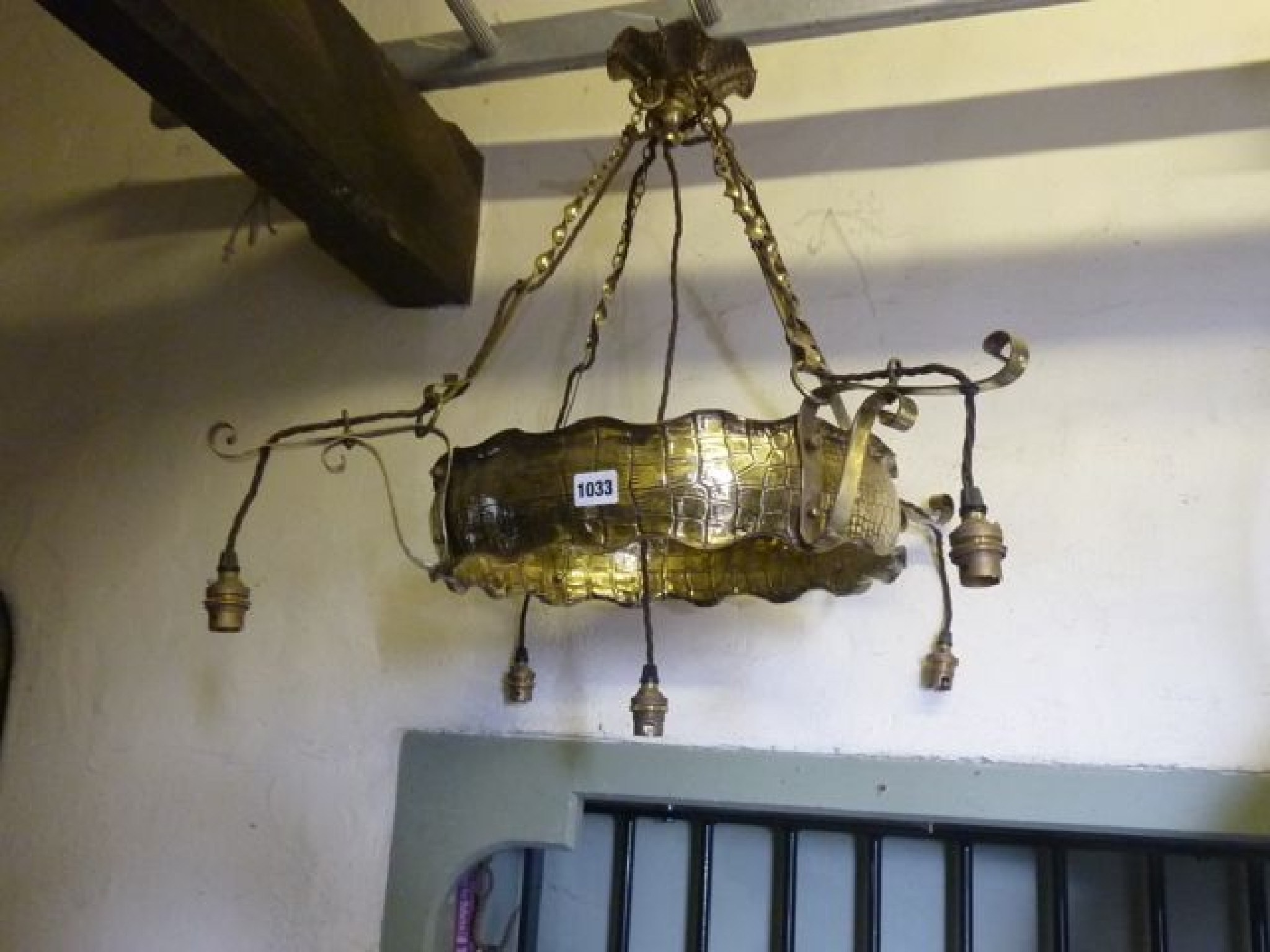 Appraisal: An Edwardian brass ceiling light to support four bulbs the