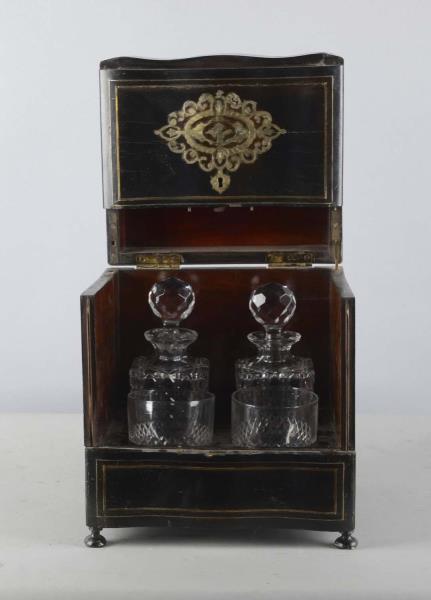 Appraisal: Tantalus Two Decanter Set Black lacquer with brass inlay design