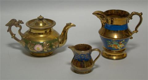 Appraisal: THREE PIECES OF LUSTRE WARE Comprising a teapot with molded