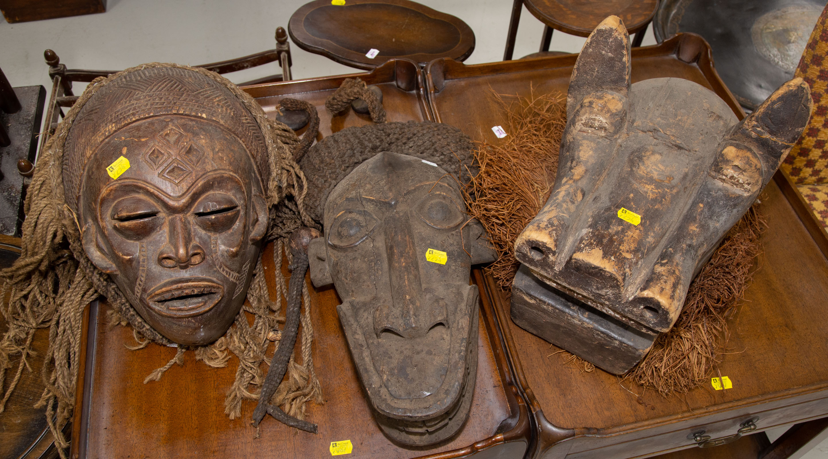 Appraisal: THREE AFRICAN WOOD MASKS th century comprising a Bamum mask