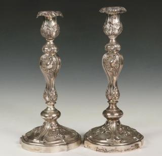 Appraisal: PAIR OF RUSSIAN SILVER CANDLESTICKS Baroque Style Hollow Repousse Candlesticks