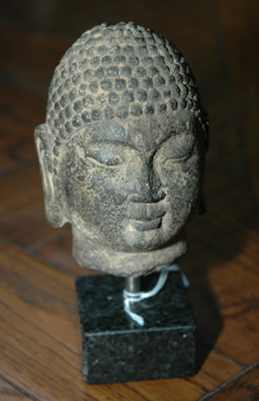 Appraisal: A CARVED STONE BUST OF A BODHISATTVA Height cm