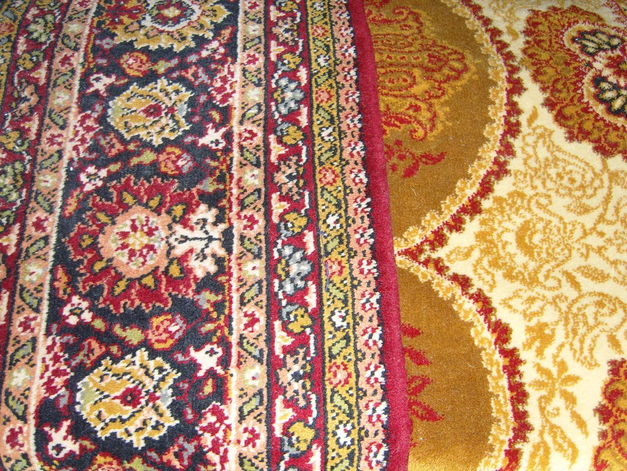 Appraisal: A white ground wool carpet with Persian style trailing floral