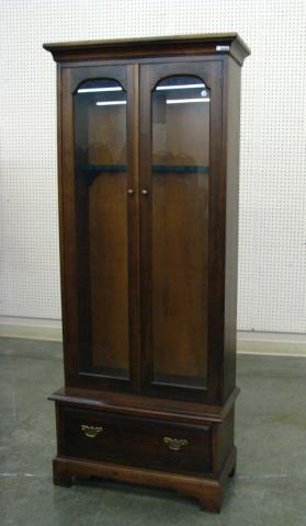 Appraisal: Dark wood finish gun cabinet with glass door and lower