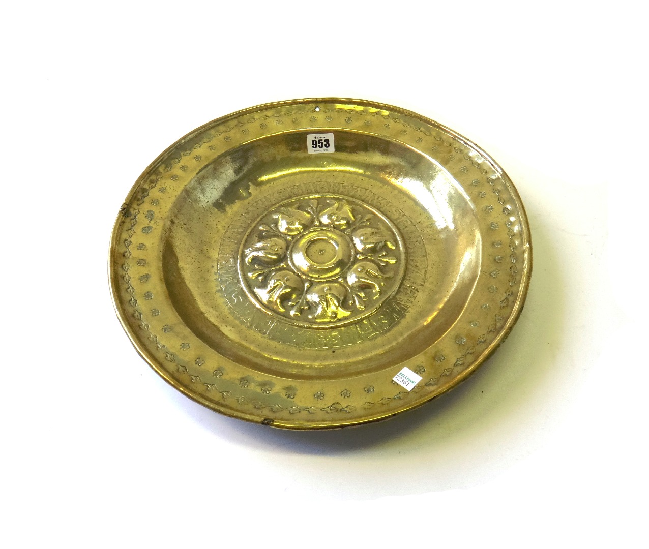 Appraisal: A Nuremberg brass alms dish th century with raised stylized