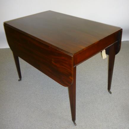 Appraisal: A GEORGE III MAHOGANY PEMBROKE TABLE c of rounded oblong