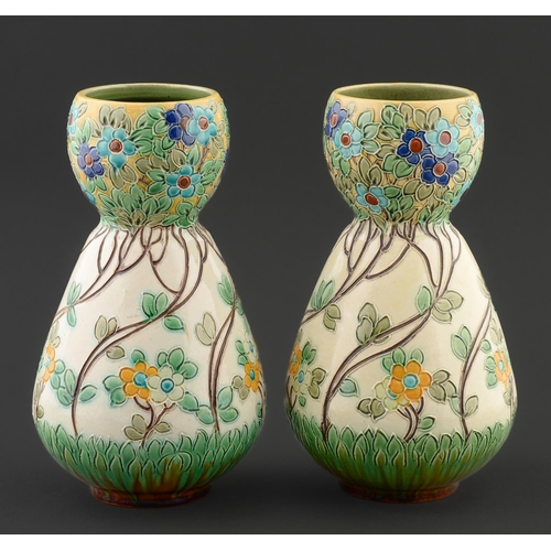 Appraisal: Art pottery A pair of Burmantofts garlic necked vases c