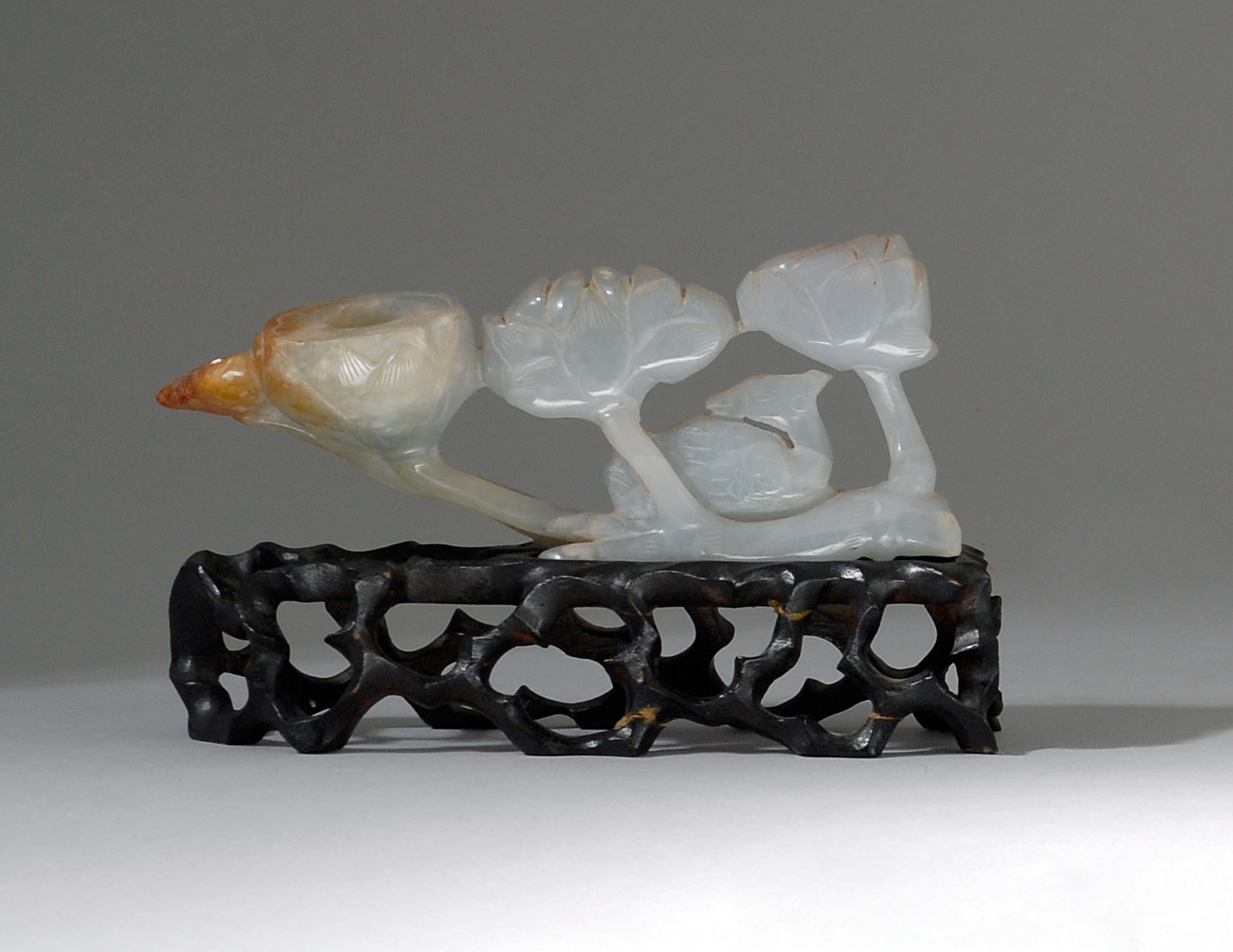 Appraisal: PALE GREEN AND RED JADE CARVING Early th CenturyIn the