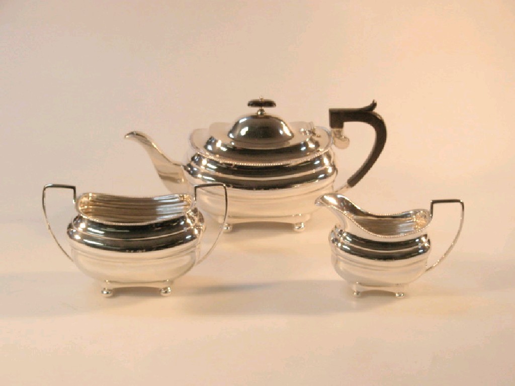 Appraisal: An early George V silver three-piece tea service boat shape