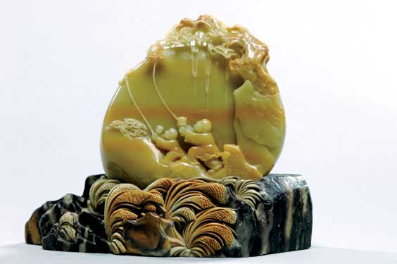 Appraisal: CARVED SEALSTONE MOUNTAIN Chinese carved sealstone mountain of yellow and