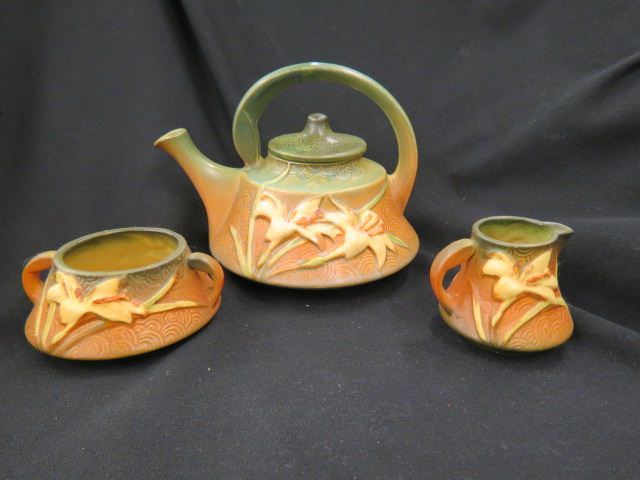 Appraisal: Roseville Pottery Zephyr Lily Tea Set green brown teapot is