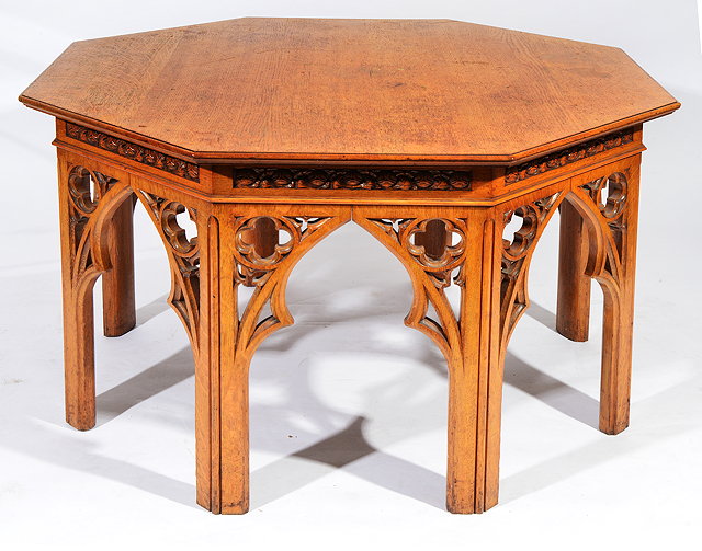 Appraisal: A VICTORIAN GOTHIC REVIVAL OAK OCTAGONAL CENTRE TABLE with carved