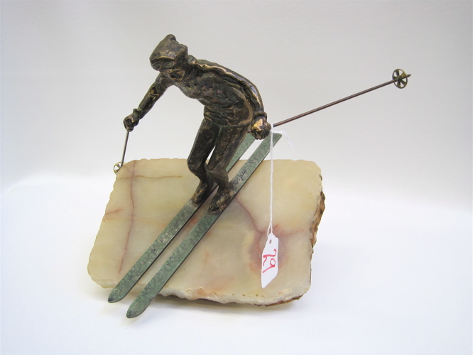 Appraisal: CURTIS JERE METAL AND STONE SCULPTURE of a skier on