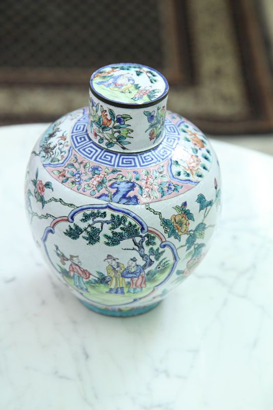 Appraisal: ORIENTAL COVERED VASE White enameled vase with polychrome decoration depicting