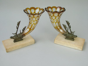 Appraisal: A pair of continental amber flash cut cornucopia posy holders