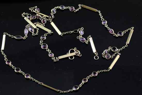 Appraisal: A continental gold and ruby set spectacle and bar link