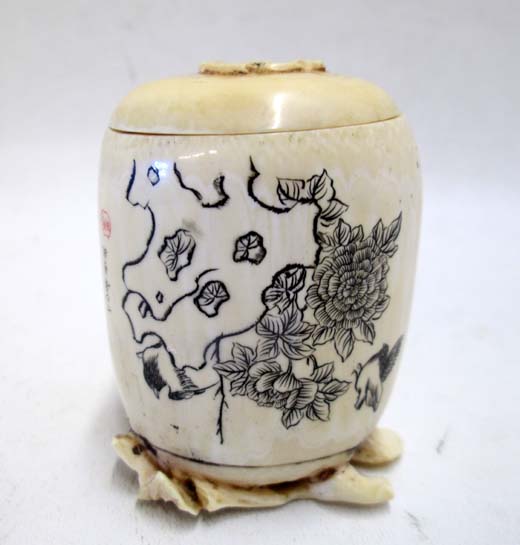 Appraisal: MINIATURE IVORY CARVED LIDDED JAR having finely incised detail with