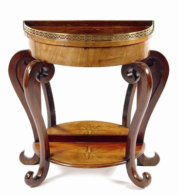 Appraisal: A Dutch rosewood and mahogany console table with scroll supports