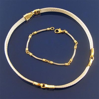 Appraisal: A steel and gold necklace with matching bracelet by Fred