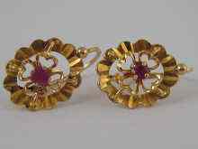 Appraisal: A pair of French hallmarked carat gold ruby earrings drop