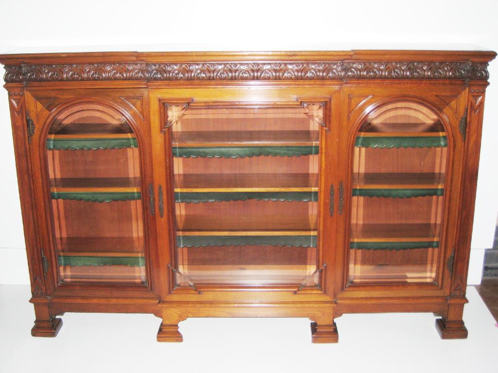 Appraisal: A mahogany Breakfront Bookcase having carved acanthus leaf frieze above