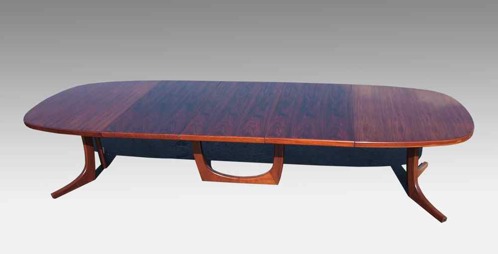 Appraisal: DYRLUND ROSEWOOD DANISH MODERN DINING TABLE WITH LEAVES Unusual triple