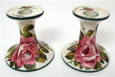 Appraisal: WEMYSS PAIR OF CHAMBER CANDLESTICKS EARLY TH CENTURY decorated by