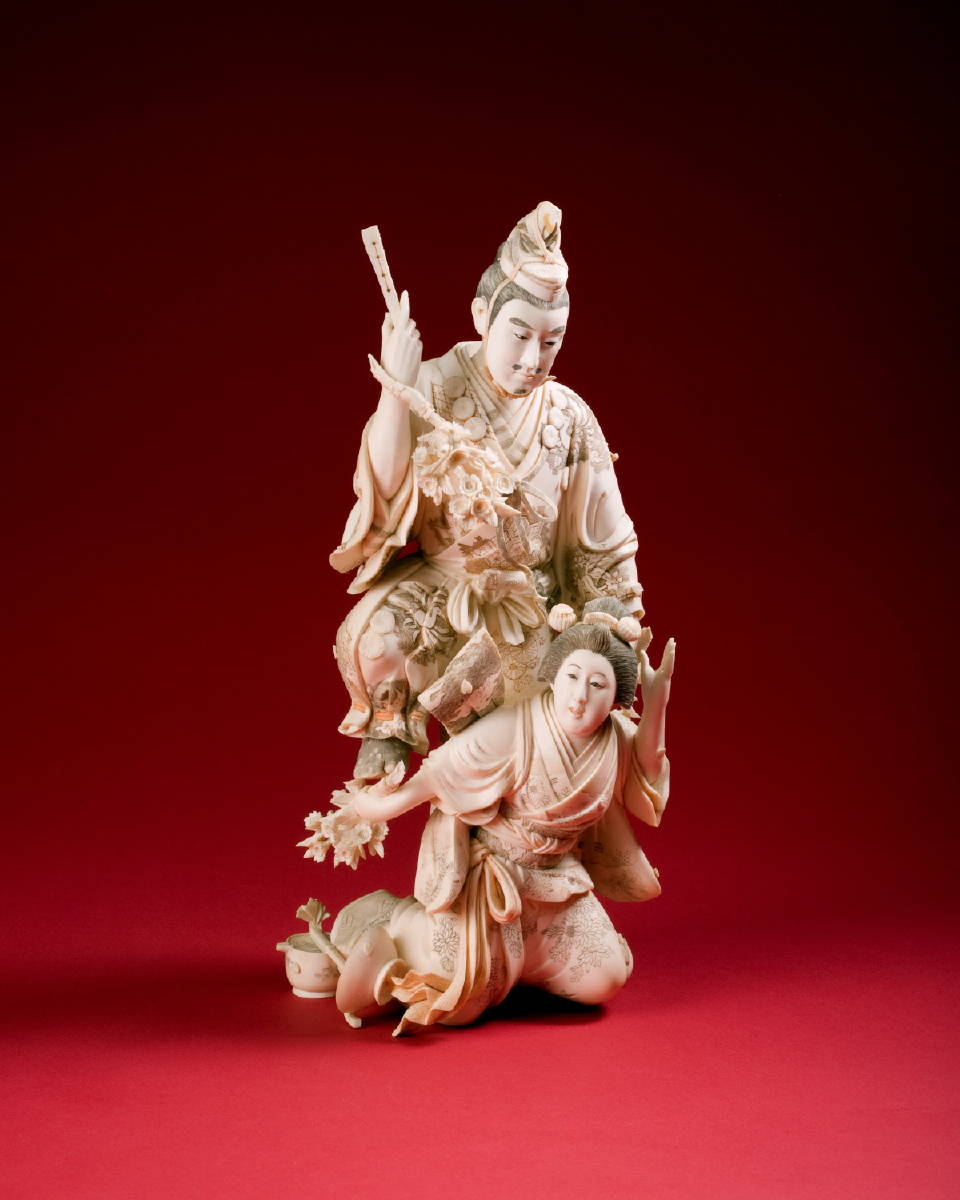 Appraisal: JAPANESE CARVED IVORY FIGURE OF A MAN AND WIFE MEIJI