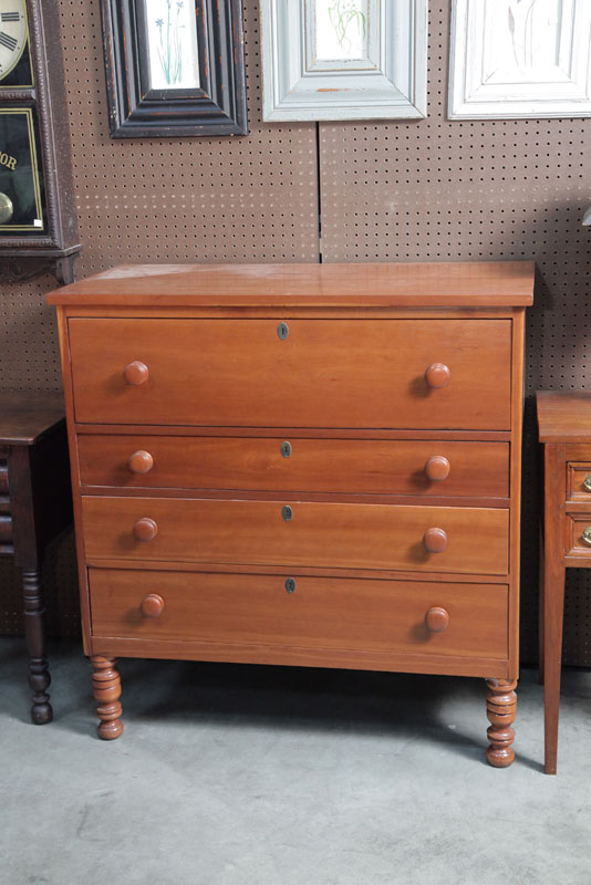 Appraisal: REPRODUCTION CHEST OF DRAWERS Cherry with a large top drawer