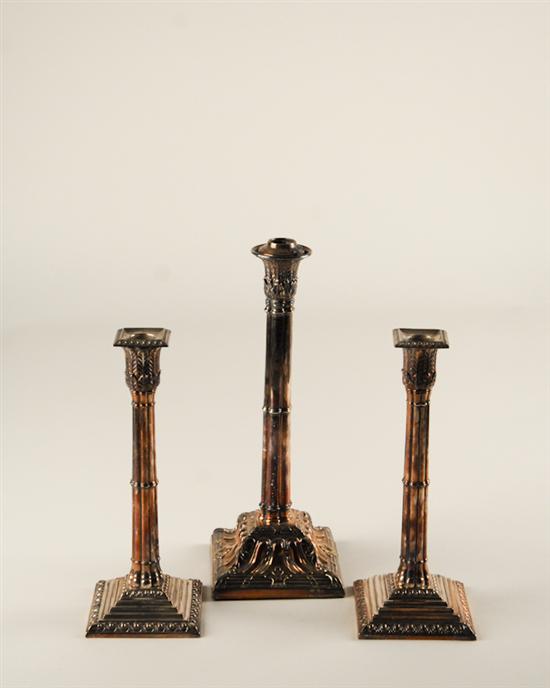 Appraisal: Three Silverplate Candlesticks reeded Corinthian fluted columns with square bases