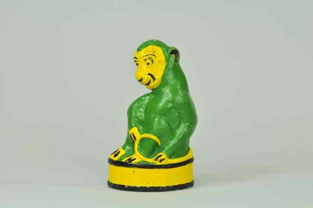 Appraisal: MONKEY ON BARREL DOORSTOP Cast iron marked ''No ''Taylor Cook